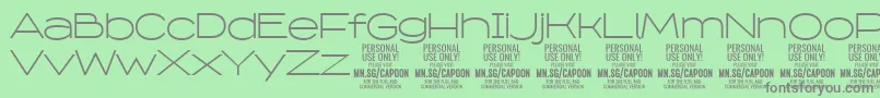 フォントCapoonLigh PERSONAL – 緑の背景に灰色の文字
