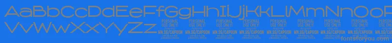 CapoonMedi PERSONAL-Schriftart – Graue Schriften auf blauem Hintergrund