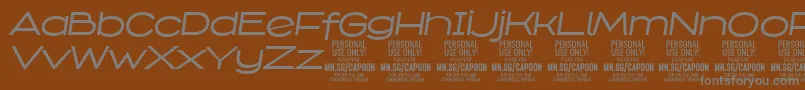 Шрифт CapoonMediIt PERSONAL – серые шрифты на коричневом фоне