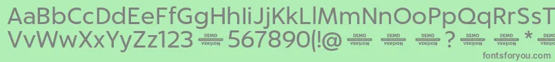 Captura RegularDemo-fontti – harmaat kirjasimet vihreällä taustalla