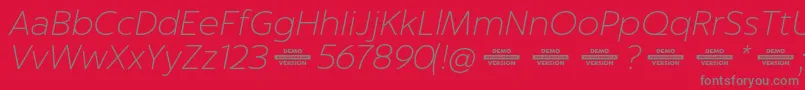 Captura ThinItalicDemo Font – Gray Fonts on Red Background