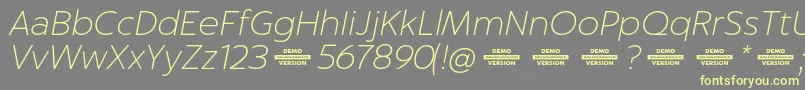 Captura ThinItalicDemo Font – Yellow Fonts on Gray Background