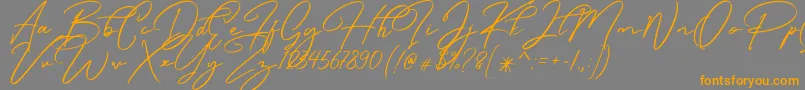 Caramello Free-Schriftart – Orangefarbene Schriften auf grauem Hintergrund