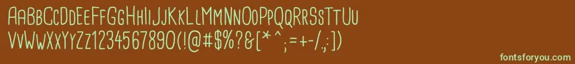 フォントCardenioModern Regular – 緑色の文字が茶色の背景にあります。