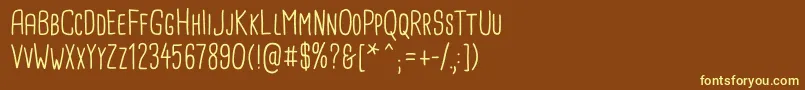 CardenioModern Regular-fontti – keltaiset fontit ruskealla taustalla