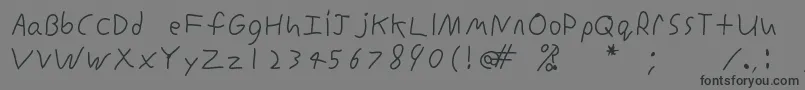 フォントInconsistentprintRegular – 黒い文字の灰色の背景