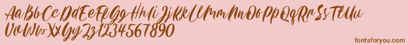 Carily DEMO VERSION-Schriftart – Braune Schriften auf rosa Hintergrund