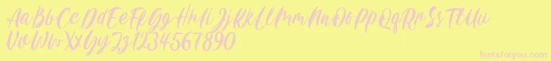 Шрифт Carily DEMO VERSION – розовые шрифты на жёлтом фоне