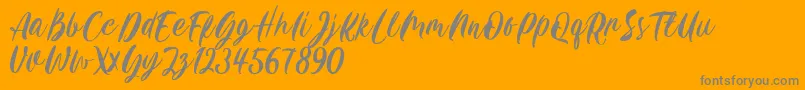 Carily DEMO VERSION-Schriftart – Graue Schriften auf orangefarbenem Hintergrund