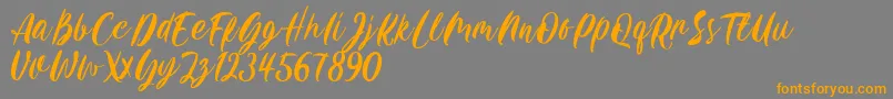 Carily DEMO VERSION-fontti – oranssit fontit harmaalla taustalla
