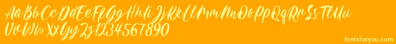 Czcionka Carily DEMO VERSION – żółte czcionki na pomarańczowym tle