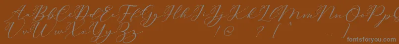 Carliste Script Demo Font – Gray Fonts on Brown Background