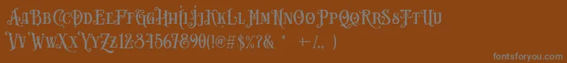 Carllosta DEMO-fontti – harmaat kirjasimet ruskealla taustalla
