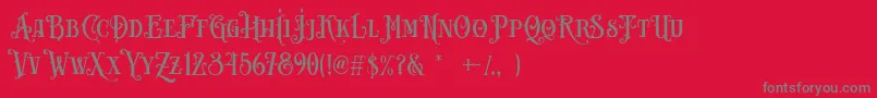 Carllosta DEMO-fontti – harmaat kirjasimet punaisella taustalla