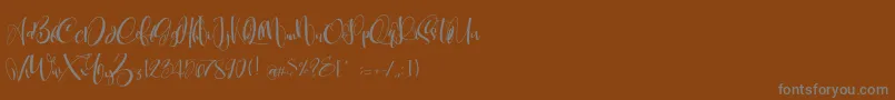 CarolynePersonalUse Font – Gray Fonts on Brown Background