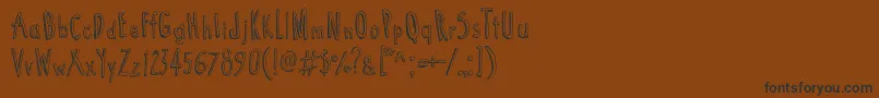 Cartoon  Tunes Font – Black Fonts on Brown Background
