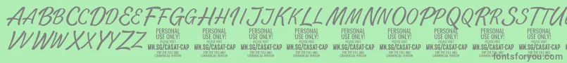 フォントCasatCapThin PERSONAL USE – 緑の背景に灰色の文字