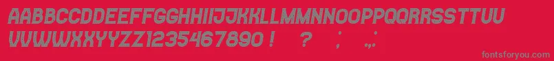 Casino Italic-fontti – harmaat kirjasimet punaisella taustalla