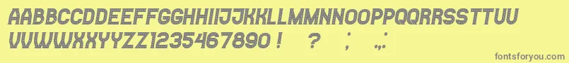 Casino Italic-fontti – harmaat kirjasimet keltaisella taustalla