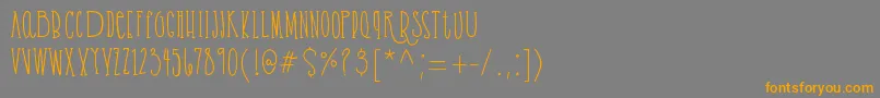 フォントCassandrabold demo – オレンジの文字は灰色の背景にあります。