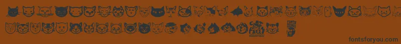 Cat Faces Font – Black Fonts on Brown Background