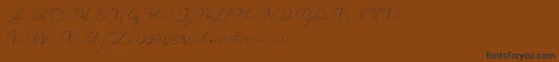 Catalan Signature Font – Black Fonts on Brown Background