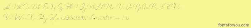 Czcionka Catalan Signature – szare czcionki na żółtym tle