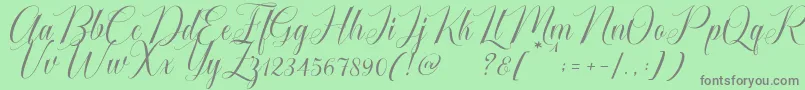 Fonte Cataline Script – fontes cinzas em um fundo verde