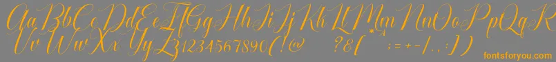 フォントCataline Script – オレンジの文字は灰色の背景にあります。