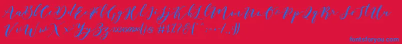 Czcionka Catandra Brush Script – niebieskie czcionki na czerwonym tle
