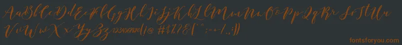 Lisätietoja Catandra Brush Script-fontista Catandra Brush Script-fontti – ruskeat fontit mustalla taustalla