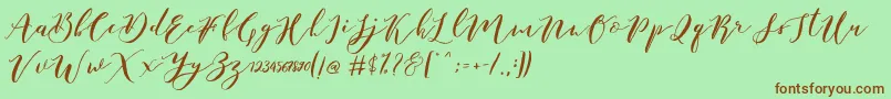 Fonte Catandra Brush Script – fontes marrons em um fundo verde