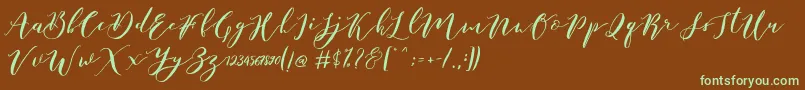 フォントCatandra Brush Script – 緑色の文字が茶色の背景にあります。