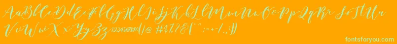 Catandra Brush Script-fontti – vihreät fontit oranssilla taustalla