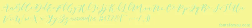 フォントCatandra Brush Script – 黄色い背景に緑の文字