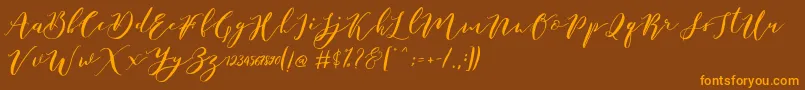 fuente Catandra Brush Script – Fuentes Naranjas Sobre Fondo Marrón