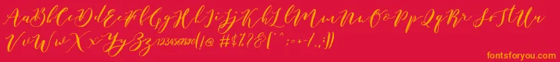 Fonte Catandra Brush Script – fontes laranjas em um fundo vermelho