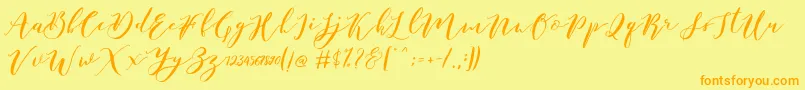 Fonte Catandra Brush Script – fontes laranjas em um fundo amarelo