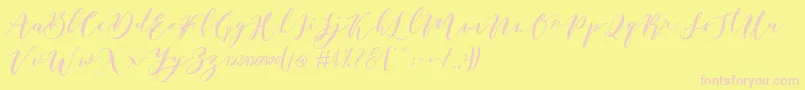 Catandra Brush Script-fontti – vaaleanpunaiset fontit keltaisella taustalla