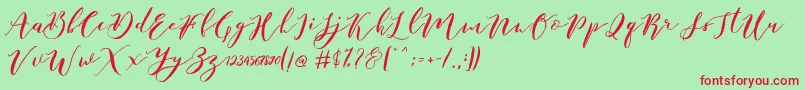 Catandra Brush Script-fontti – punaiset fontit vihreällä taustalla