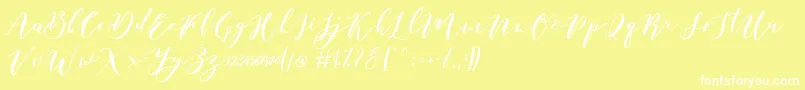 Fonte Catandra Brush Script – fontes brancas em um fundo amarelo