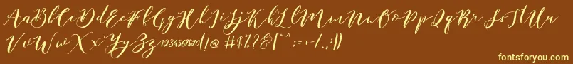 Catandra Brush Script-Schriftart – Gelbe Schriften auf braunem Hintergrund