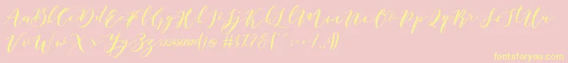 Fonte Catandra Brush Script – fontes amarelas em um fundo rosa