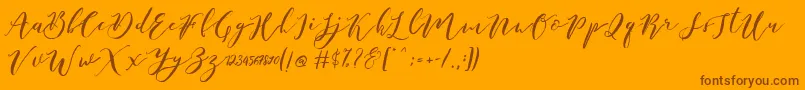 Catandra Brush Script-Schriftart – Braune Schriften auf orangefarbenem Hintergrund