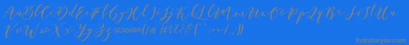 Catandra Brush Script-Schriftart – Graue Schriften auf blauem Hintergrund