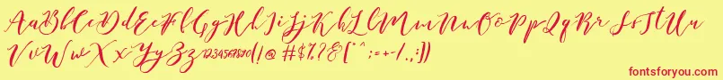 Catandra Brush Script-fontti – punaiset fontit keltaisella taustalla