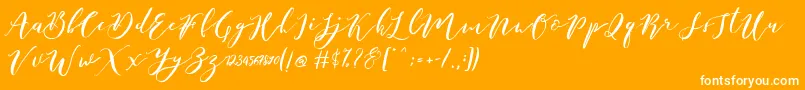 Catandra Brush Script-fontti – valkoiset fontit oranssilla taustalla