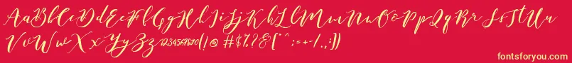 フォントCatandra Brush Script – 黄色の文字、赤い背景