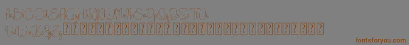 Cattalleya Demo-Schriftart – Braune Schriften auf grauem Hintergrund