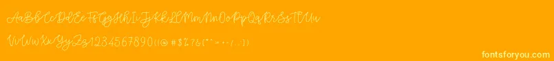 Cattomscute Font – Yellow Fonts on Orange Background